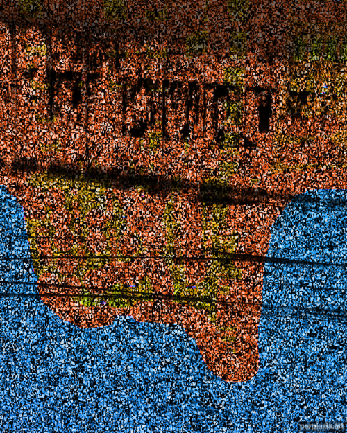 A flat but cellular and detailed picture of orange color dripping from black structures into a field of blue.